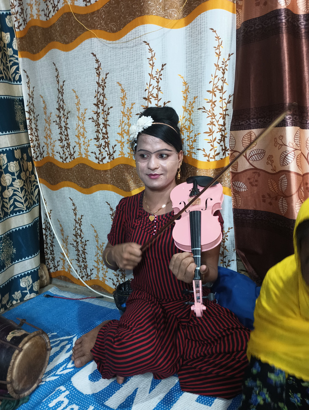 Rohingya woman with violin
